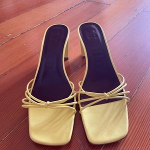 Strappy yellow sandals by Staud